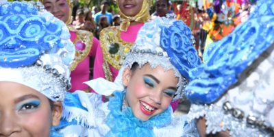 Girl smiles while participating in the Puerto Plata 2019 Carnival parade