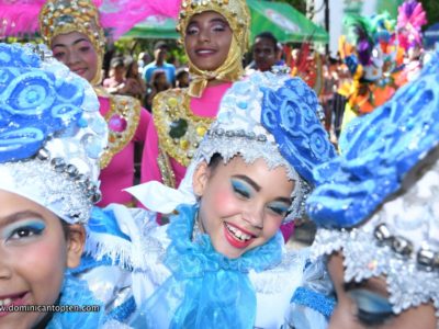 Girl smiles while participating in the Puerto Plata 2019 Carnival parade